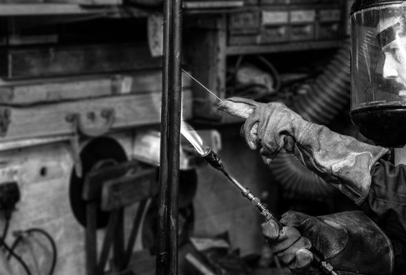 Gunsmith working on barrel